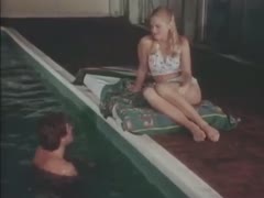 The little, golden-haired beauty in the water is already dressed like nature.